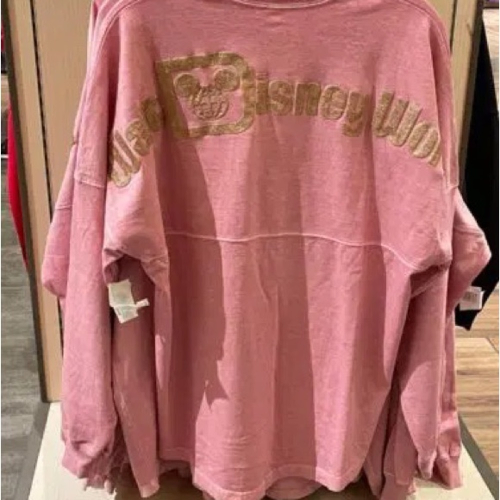 Disney pink jersey with gold letters